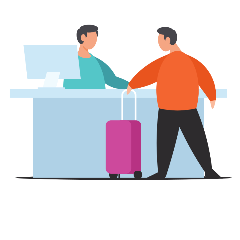 Man checking in with suitcase at reception desk.