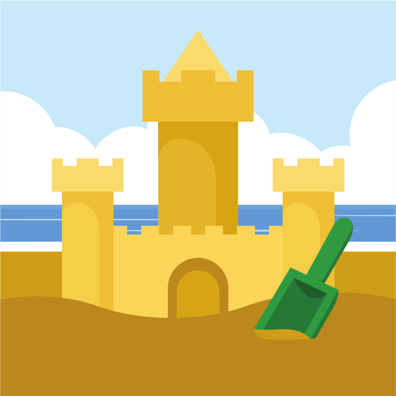 A sandcastle with a shovel on the beach.