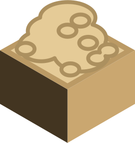 A brown cube with a sandy top