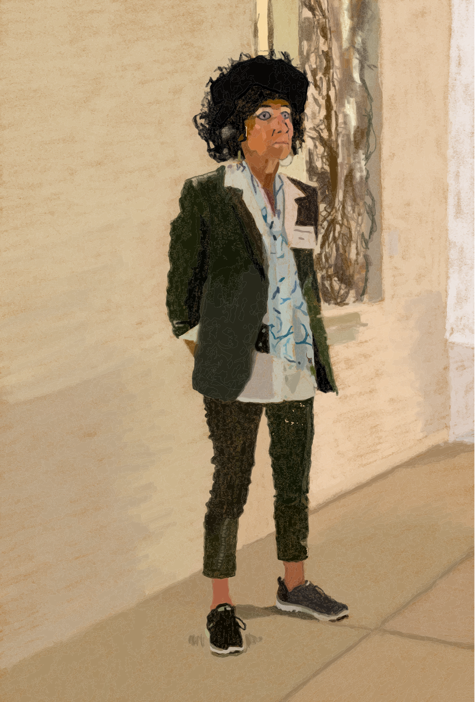 A person in a patterned suit and curly wig stands.