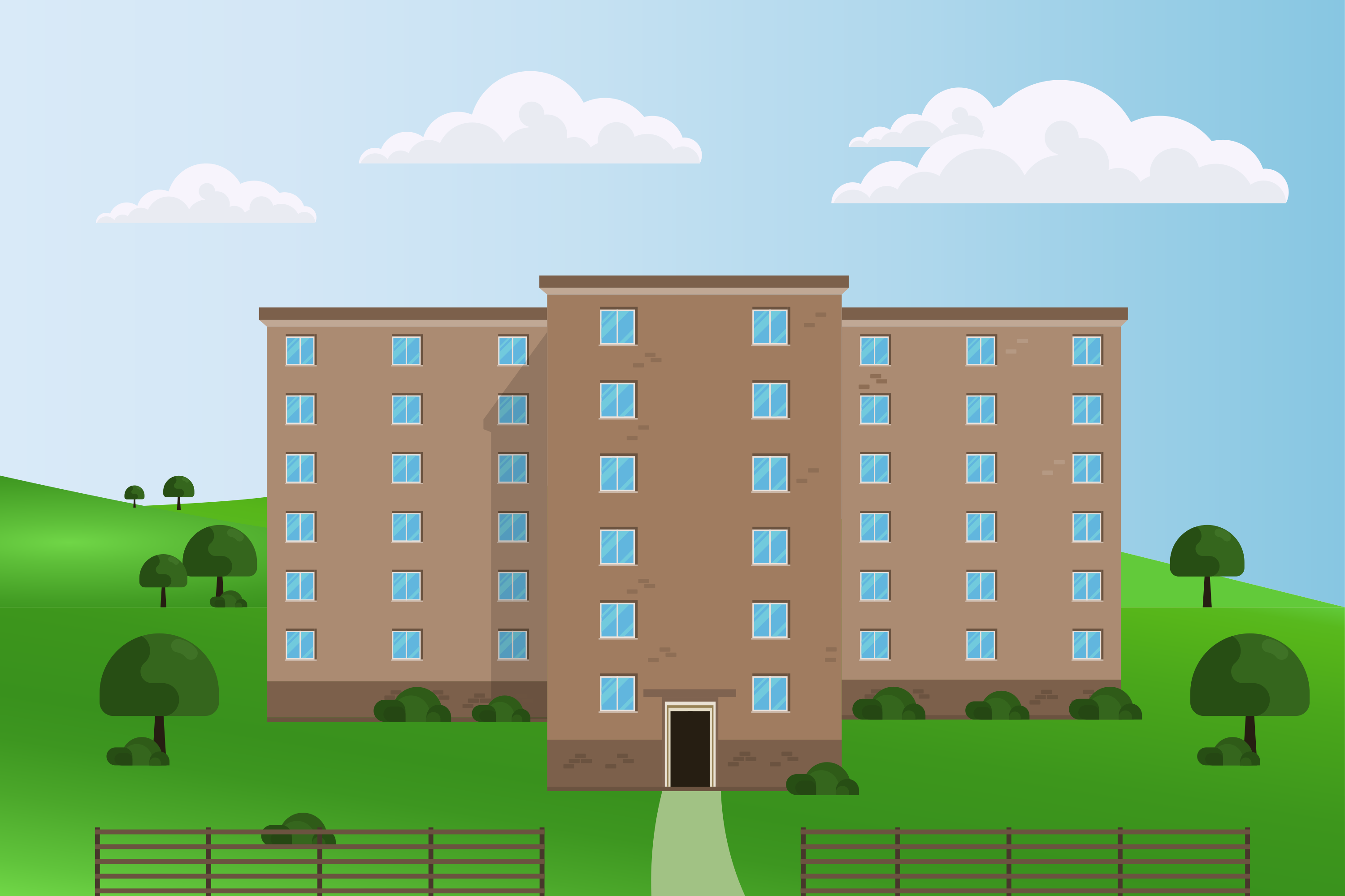 Un edificio alto y marrón en una colina cubierta de hierba.