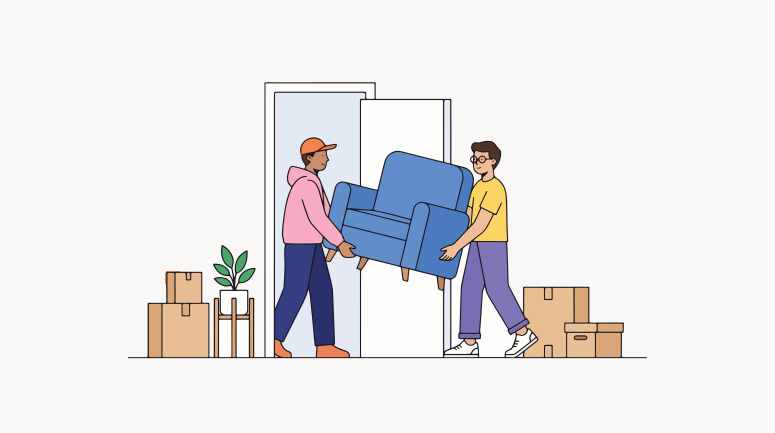 Two men carry a blue armchair through a doorway