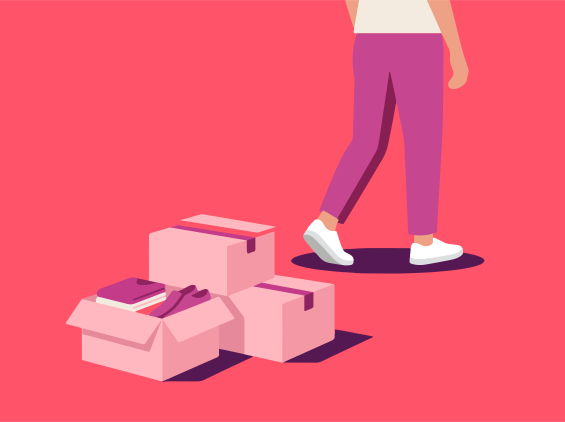 Person walking past stacked moving boxes