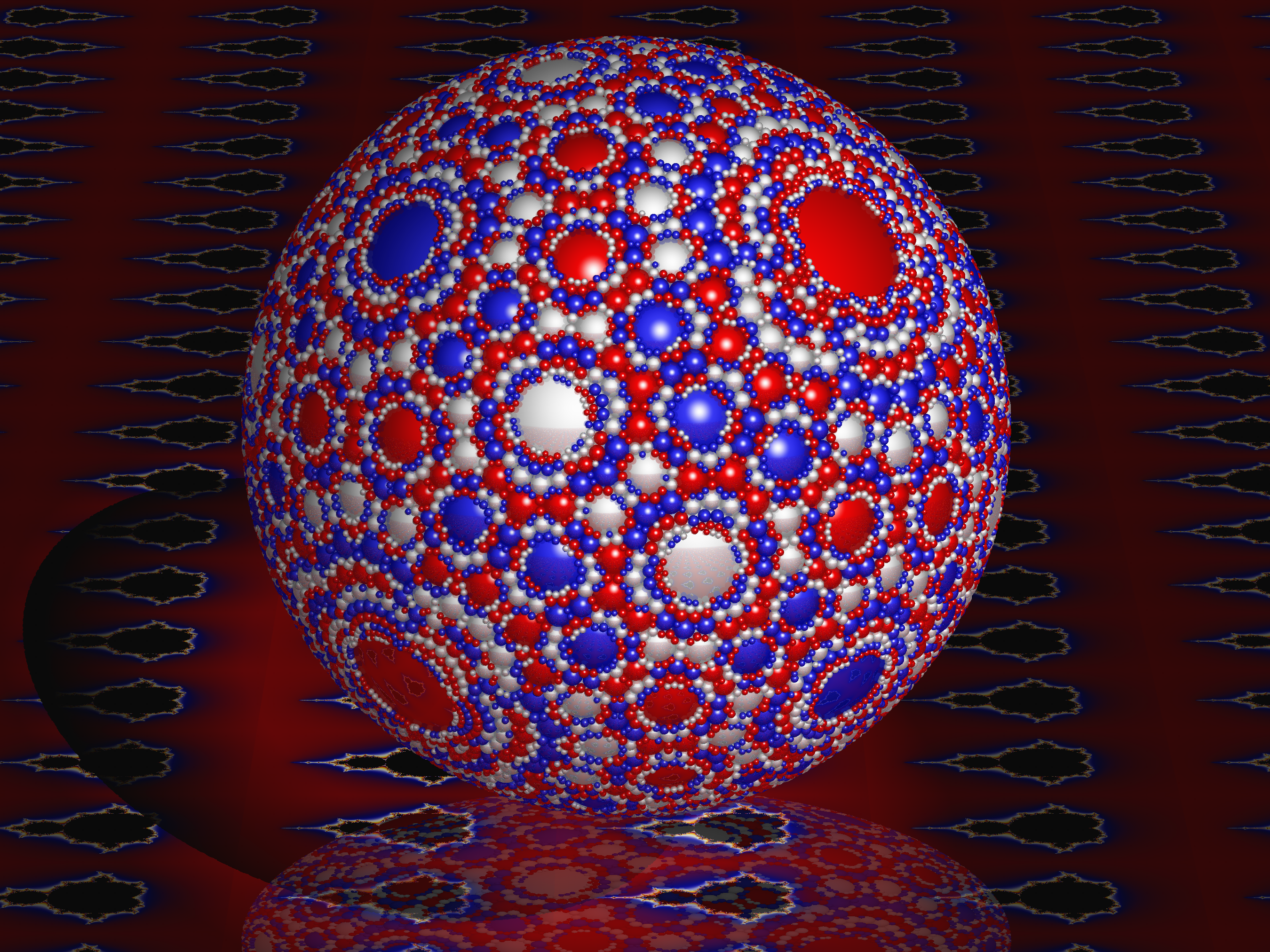 Una esfera cubierta de intrincados patrones rojos, azules y blancos.