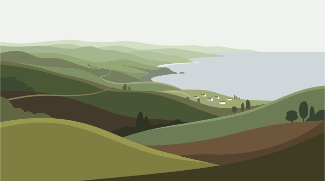 Rolling green hills meet the ocean coastline