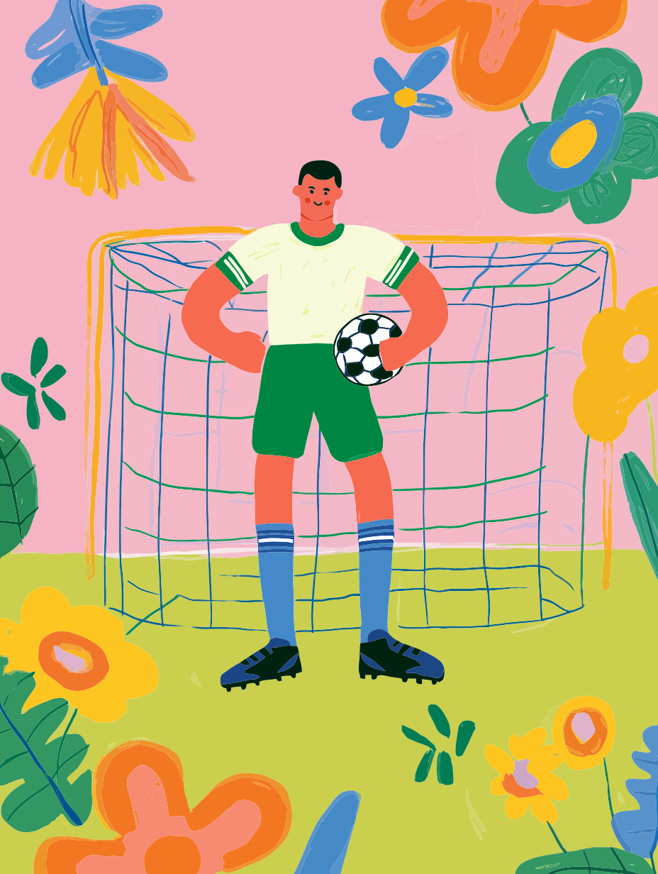 Male soccer player with ball stands before goal and flowers.