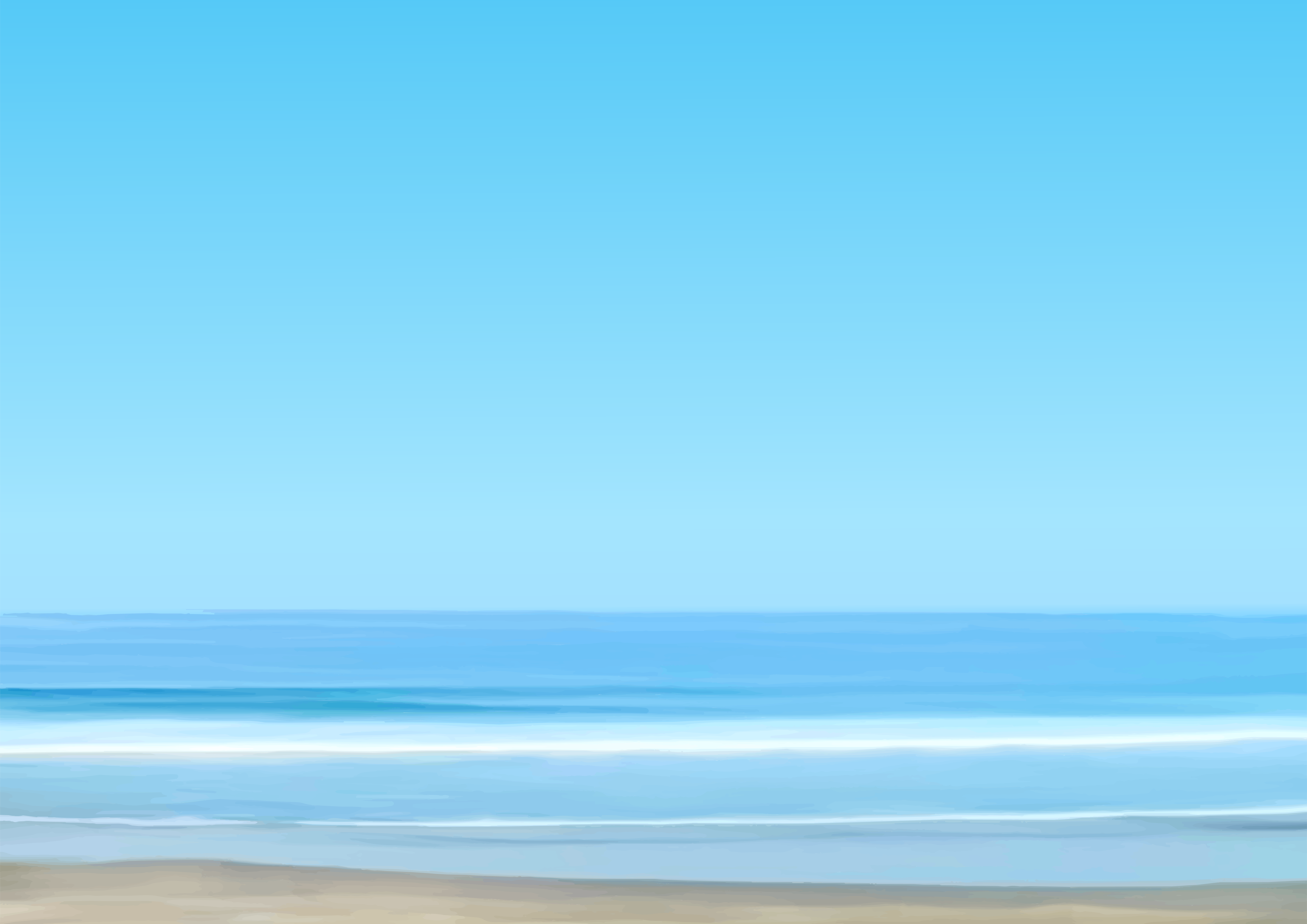 A serene beach with blue sky and gentle ocean waves.