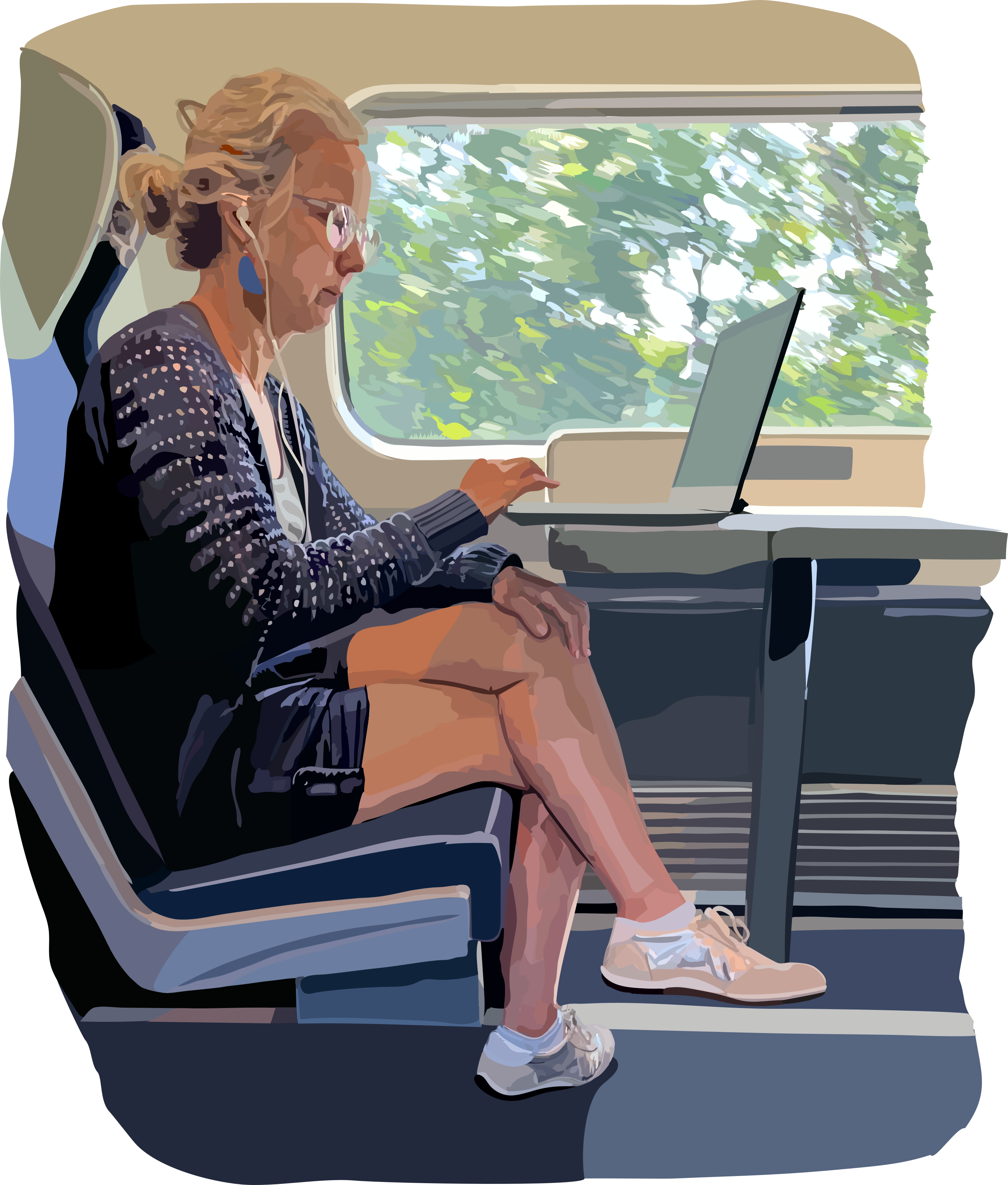 Wanita menggunakan laptop di kereta.