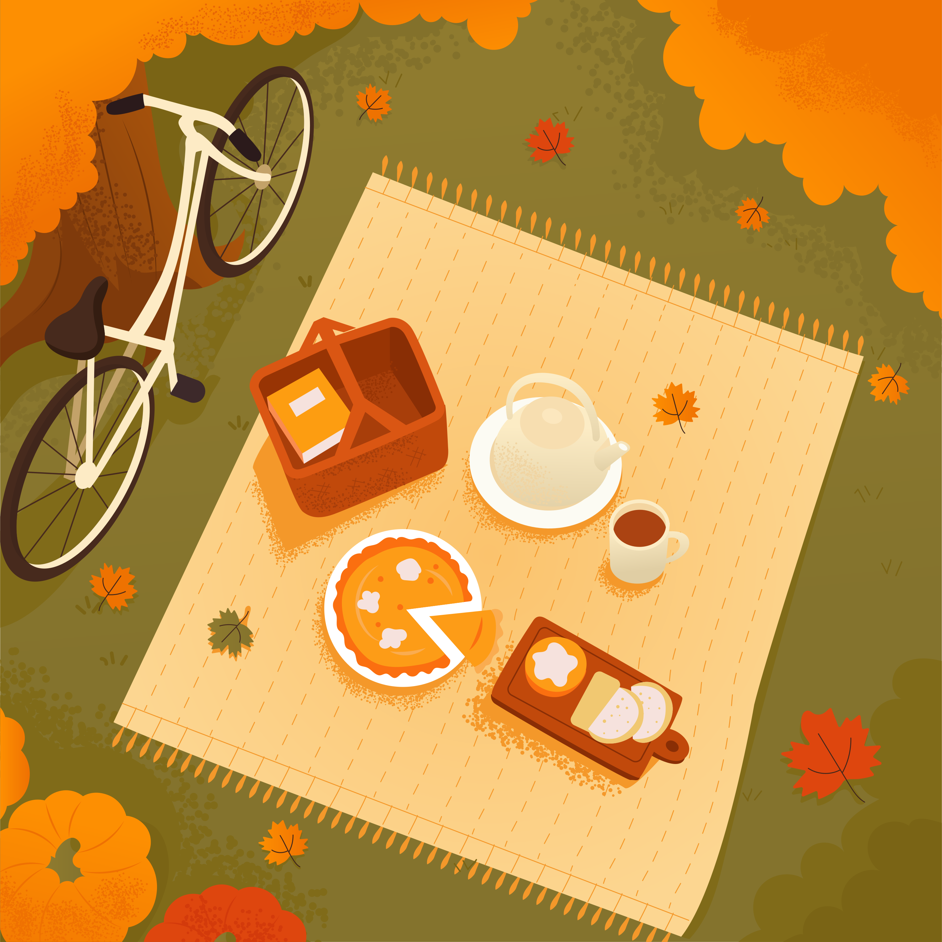 Eine Picknickdecke mit Kuchen, Tee und Fahrrad unter Herbstbäumen